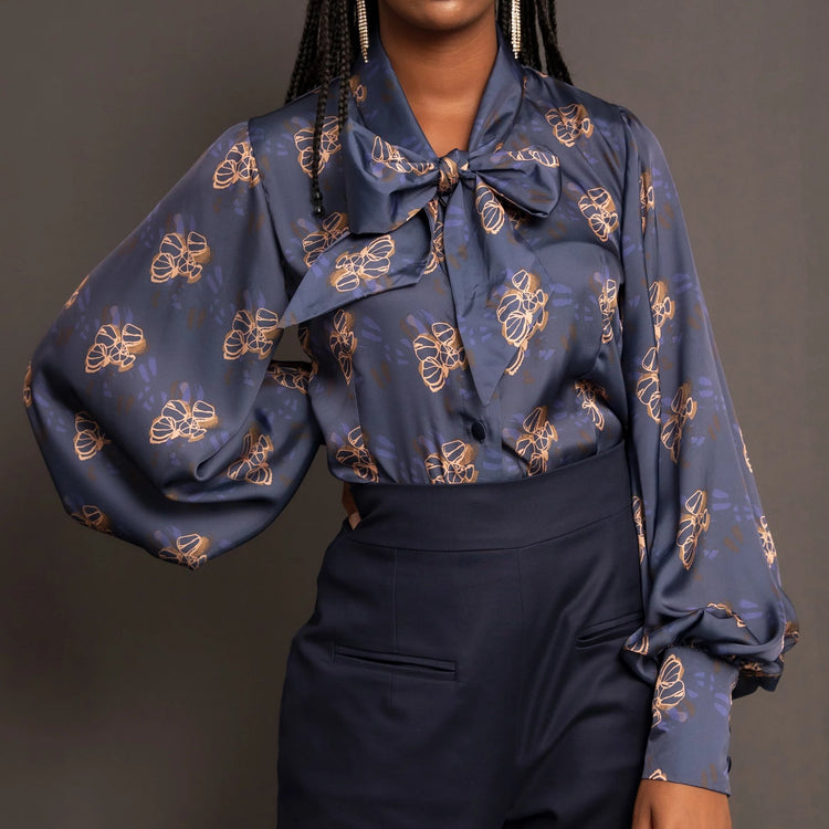Navy print silk sateen blouse with balloon sleeve and pussy bow detail.