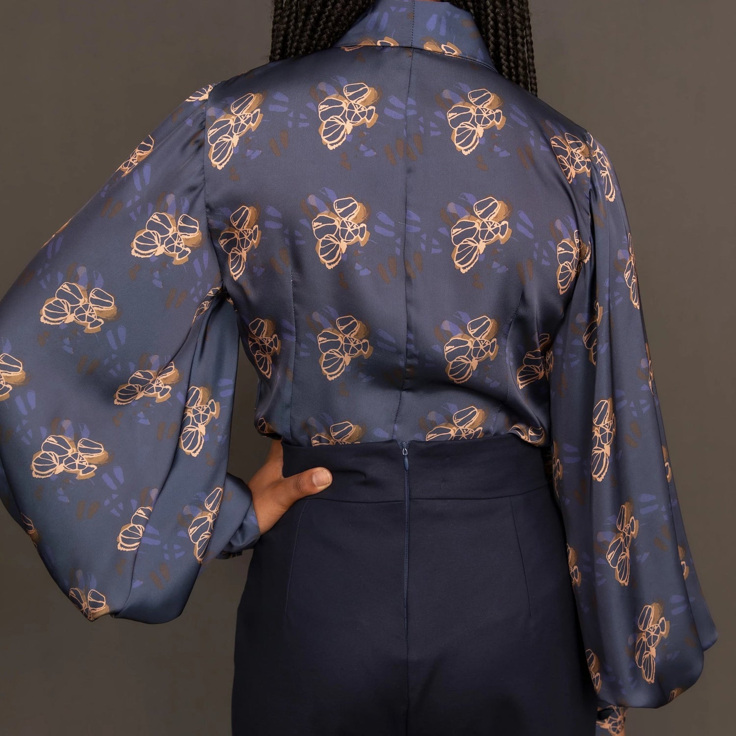 Navy print silk sateen blouse with balloon sleeve and pussy bow detail.